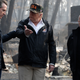 President Donald Trump talks with Gov.-elect Gavin Newsom, left, and as California Gov. Jerry Brown listens during a visit to a neighborhood impacted by the wildfires in California.